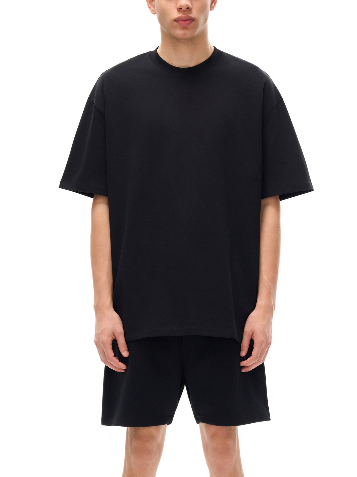 Model wearing a black heavyweight cotton t-shirt – custom printed apparel